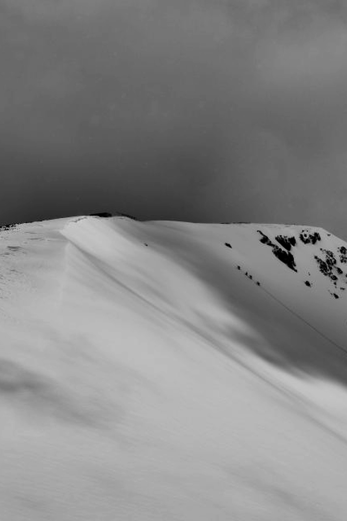 Wind-scoured snow ridge at dusk
